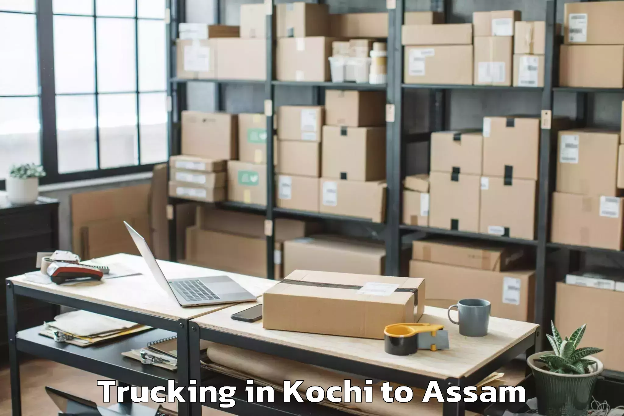 Kochi to Marigaon Trucking Booking